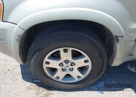 2004 Ford Escape Limited z USA, uszkodzony, nr VIN 1FMCU04174KA97935